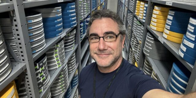 Greg Filkins taking a selfie inside the Academy Film Archives storage of films.